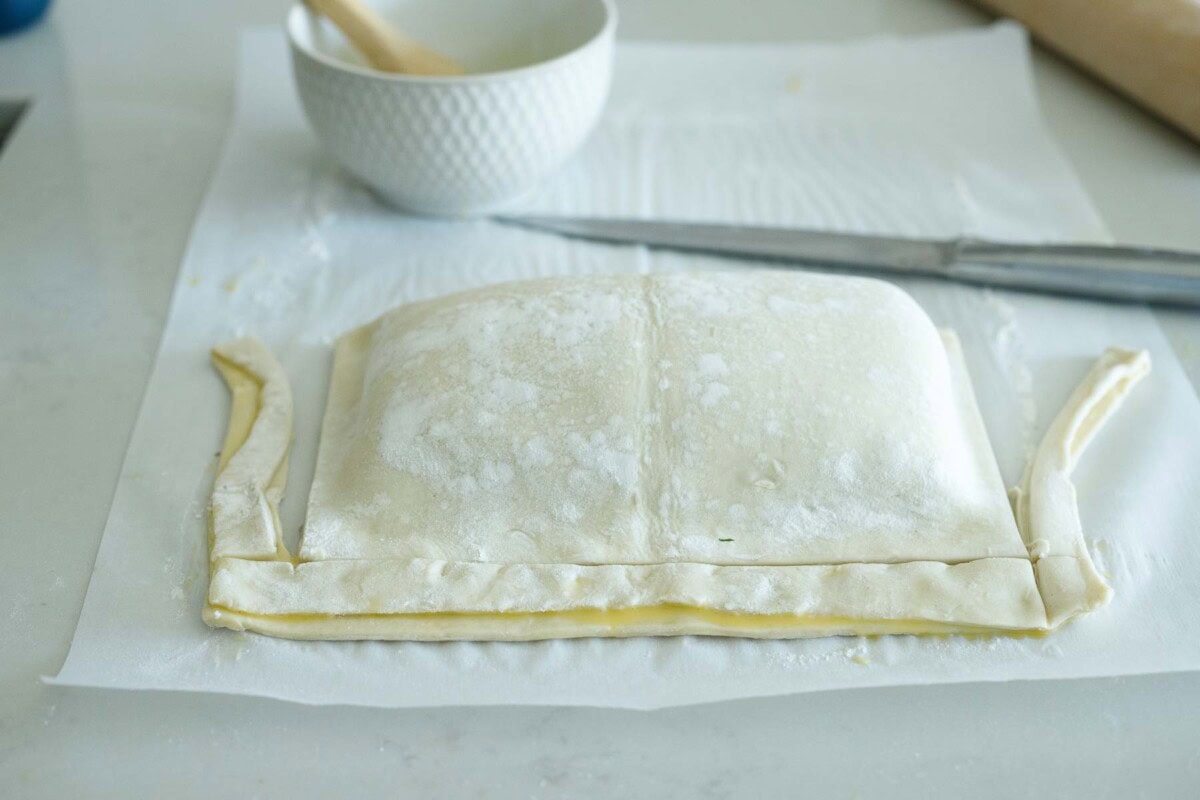 salmon wellington with puff pastry edges trimmed away.