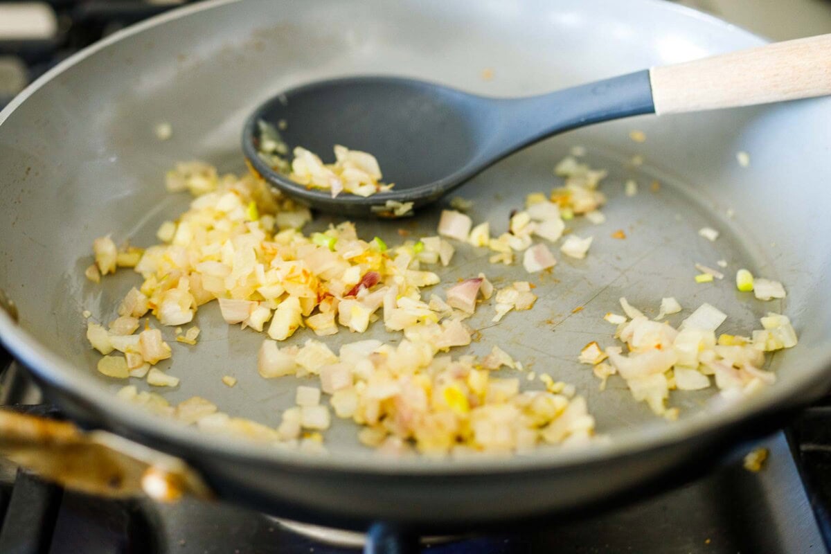 sautéing shallot and garlic in skillet.