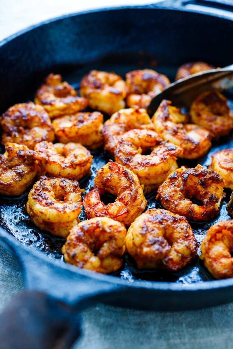 This Spicy Mexican Shrimp recipe is quick and easy, perfect for busy weeknights. Create a bowl with rice and black beans, veggies, and our creamy avocado sauce.