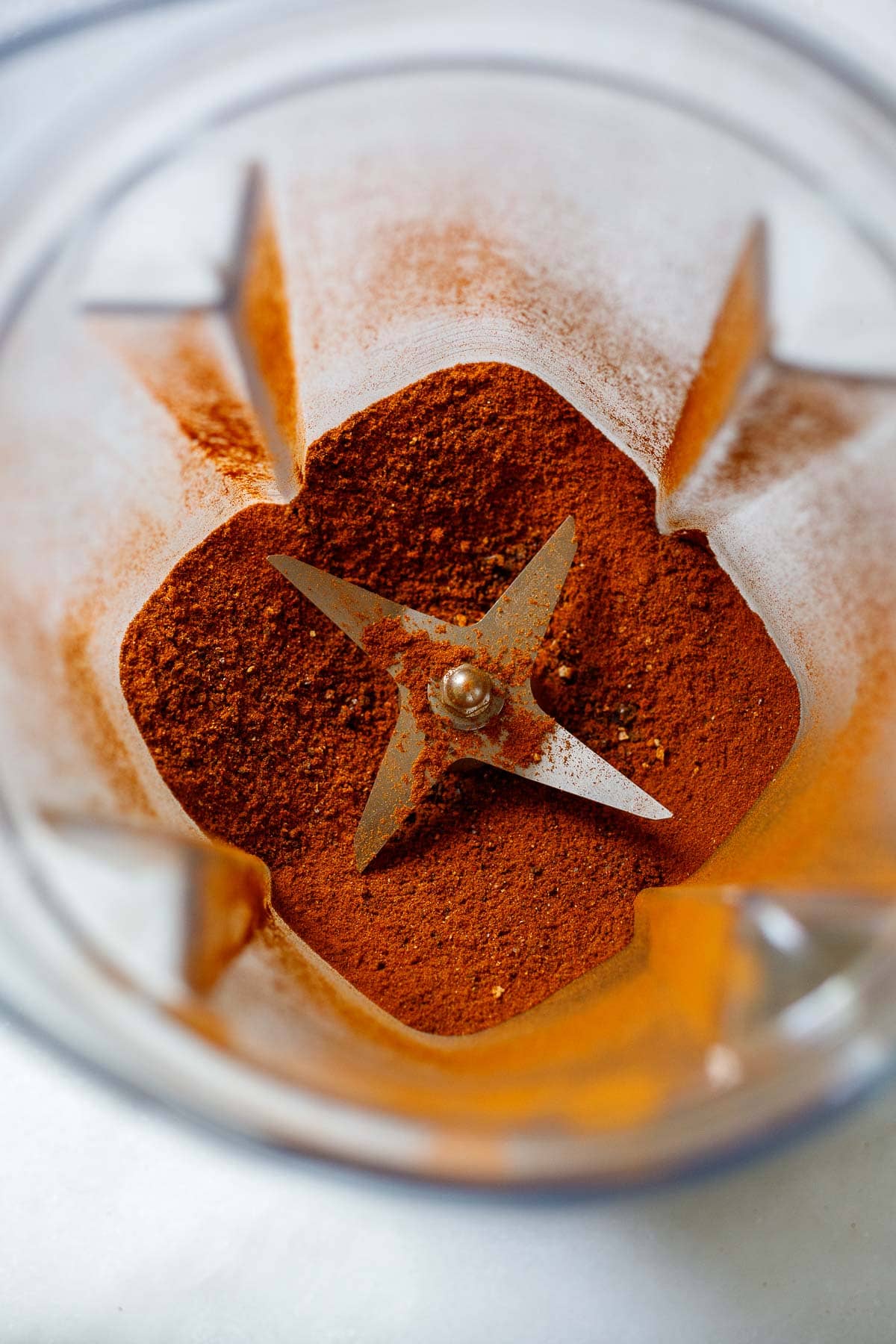 Ground chile powder in a blender. 