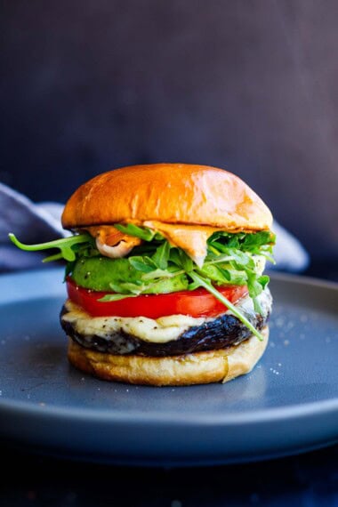 This oven-baked Portobello Mushroom Burger is loaded with healthy veggies and full of bold umami flavor! It's perfect for busy weeknight dinners and vegan-adaptable.