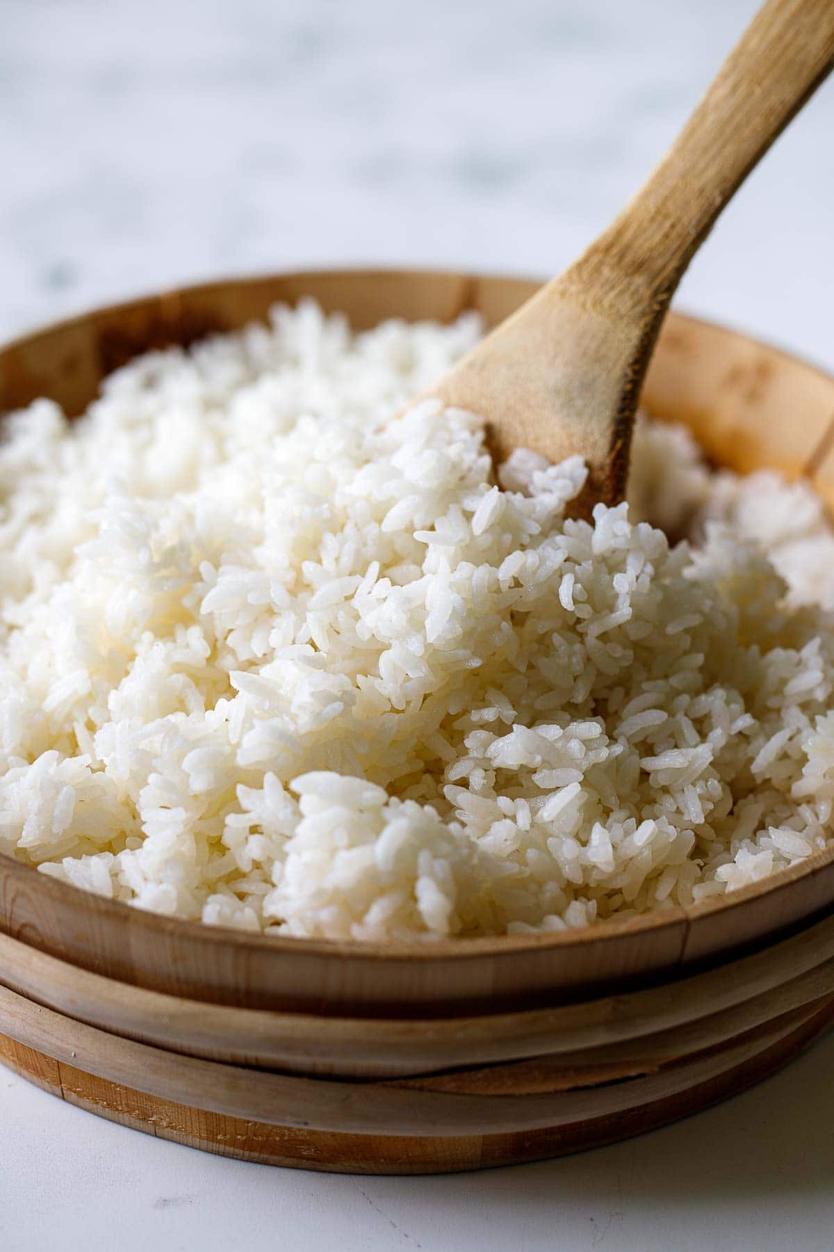 wood bowl with cooked sushi rice.