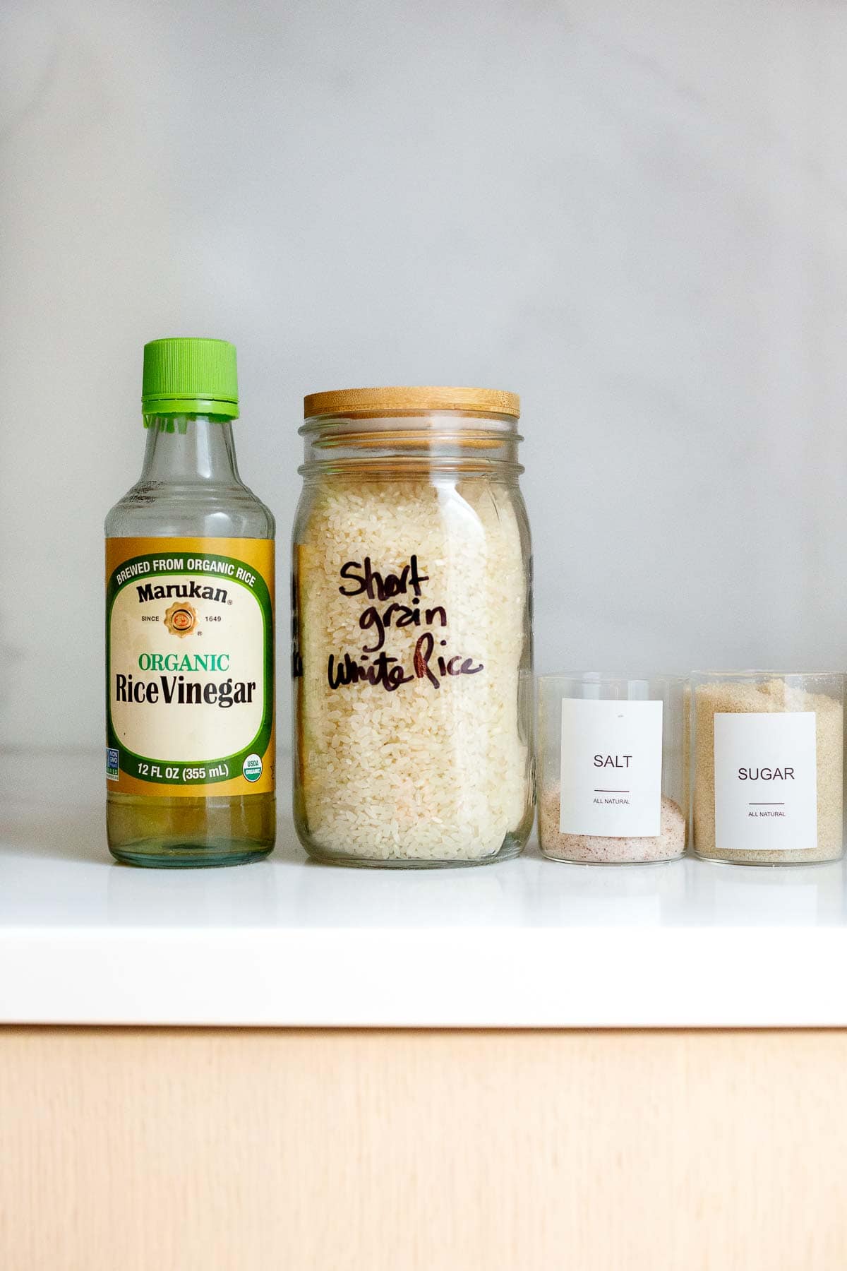 ingredients for sushi rice - rice vinegar, short grain white rice, salt, sugar.