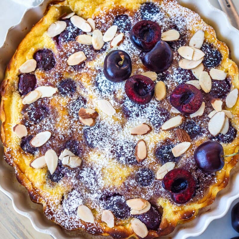 A classic French dessert, this easy Cherry Clafoutis recipe combines ripe cherries with a tender simple batter for a delightful treat. Perfect for any occasion, it impresses with its delicate custardy texture and sweet, tart flavor. Gluten-free adaptable.