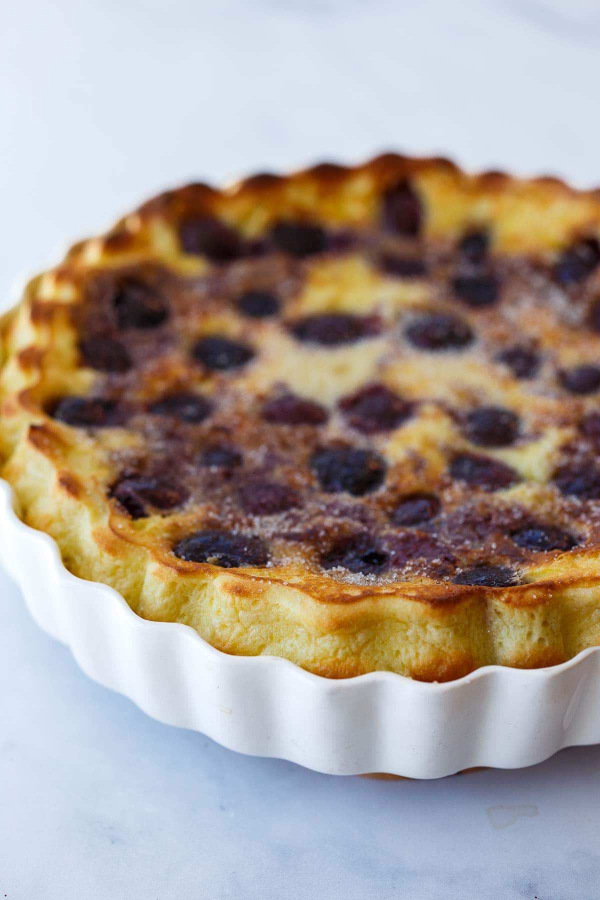 baked cherry clafoutis in baking dish.