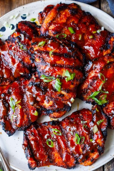 Succulent and bursting with flavor this Korean BBQ Chicken recipe is slathered with an easy homemade Korean BBQ sauce and grilled to perfection.