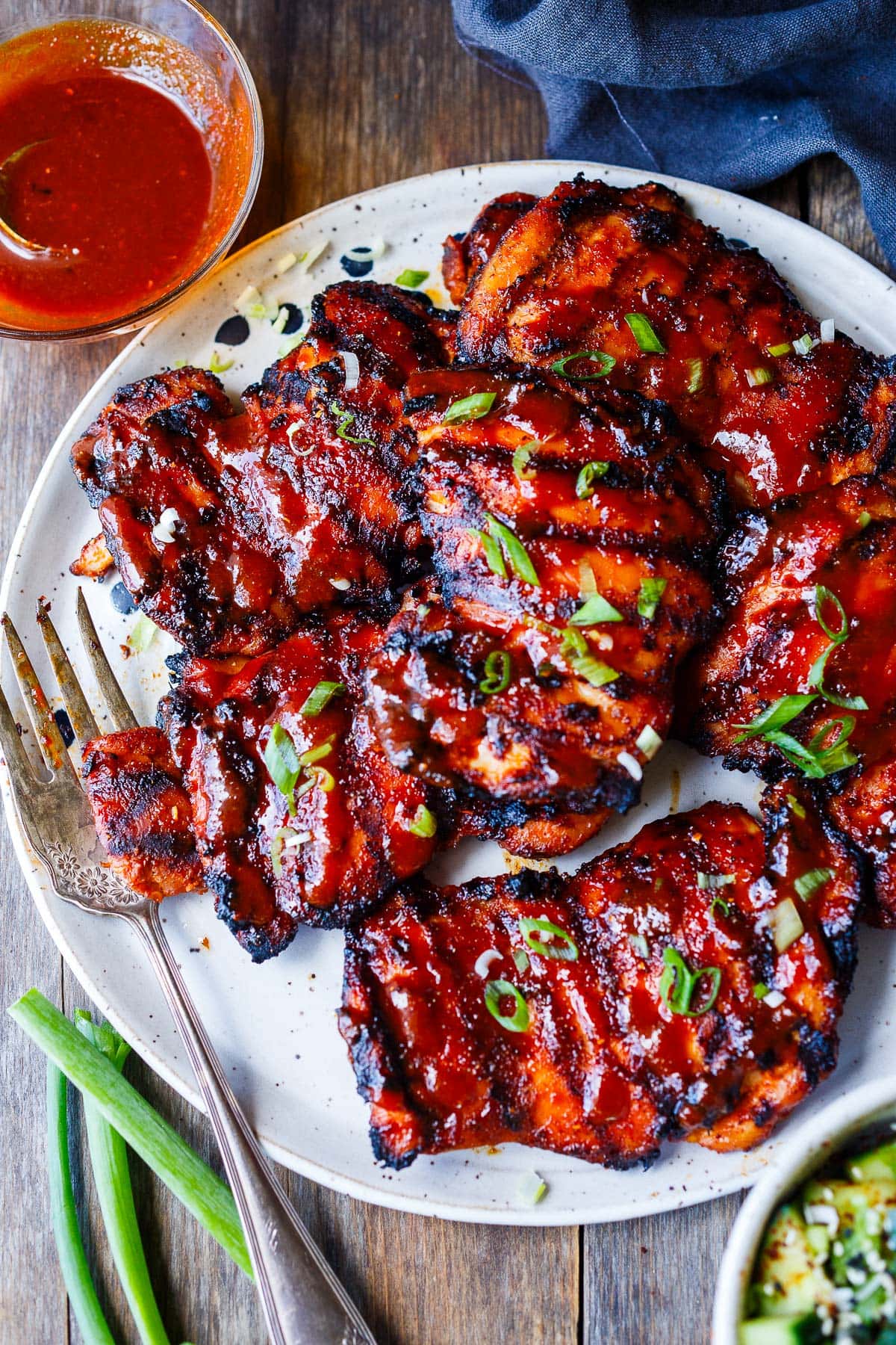 Succulent and bursting with flavor this Korean BBQ Chicken recipe is slathered with an easy homemade Korean BBQ sauce and grilled to perfection.