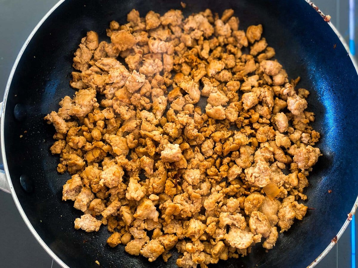 skillet with browned ground turkey meat.