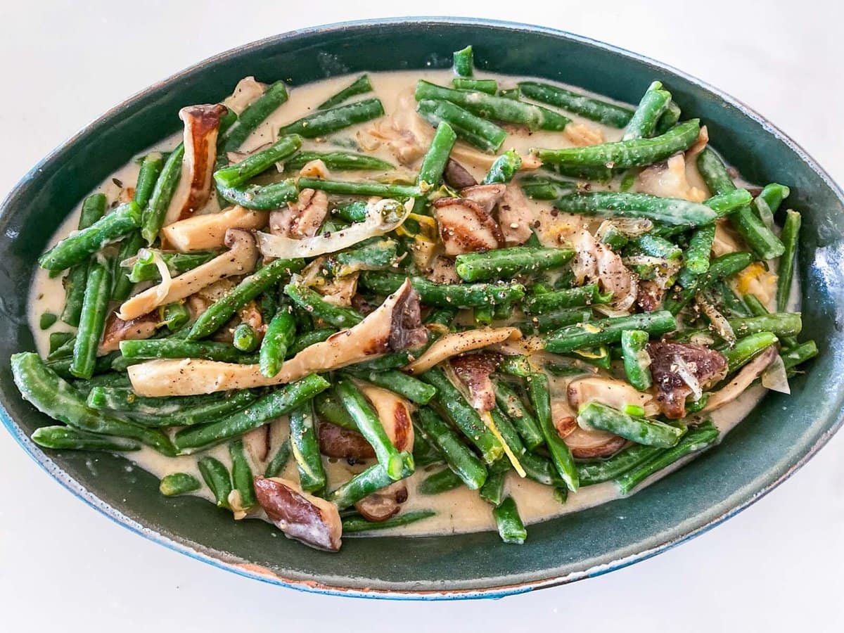 green bean casserole in oval dish before baking. 