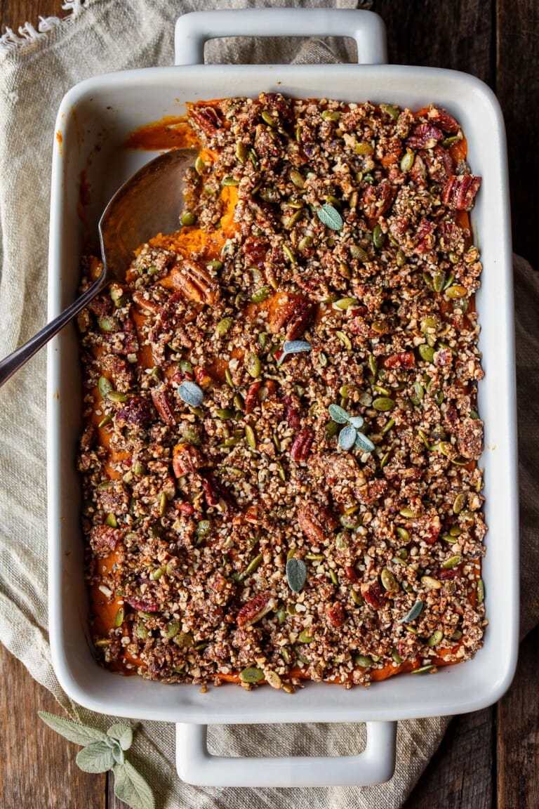 Our lightened-up version of Sweet Potato Casserole is creamy, perfectly spiced and just sweet enough with a crunchy pecan and sage crust.