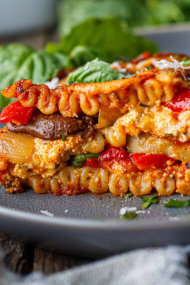 a piece of roasted vegetable lasagna on a plate.