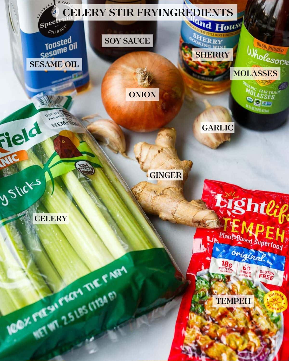 ingredients for celery stirfry- celery, tempeh, ginger, garlic, onion, molasses, sherry cooking wine, tamari, and toasted sesame oil.
