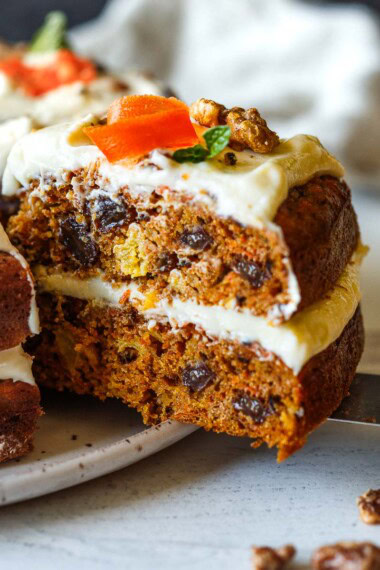 Moist and chock full of carrots, this delightful Carrot Cake recipe with cream cheese frosting offers a lightened-up version that doesn’t compromise on flavor.