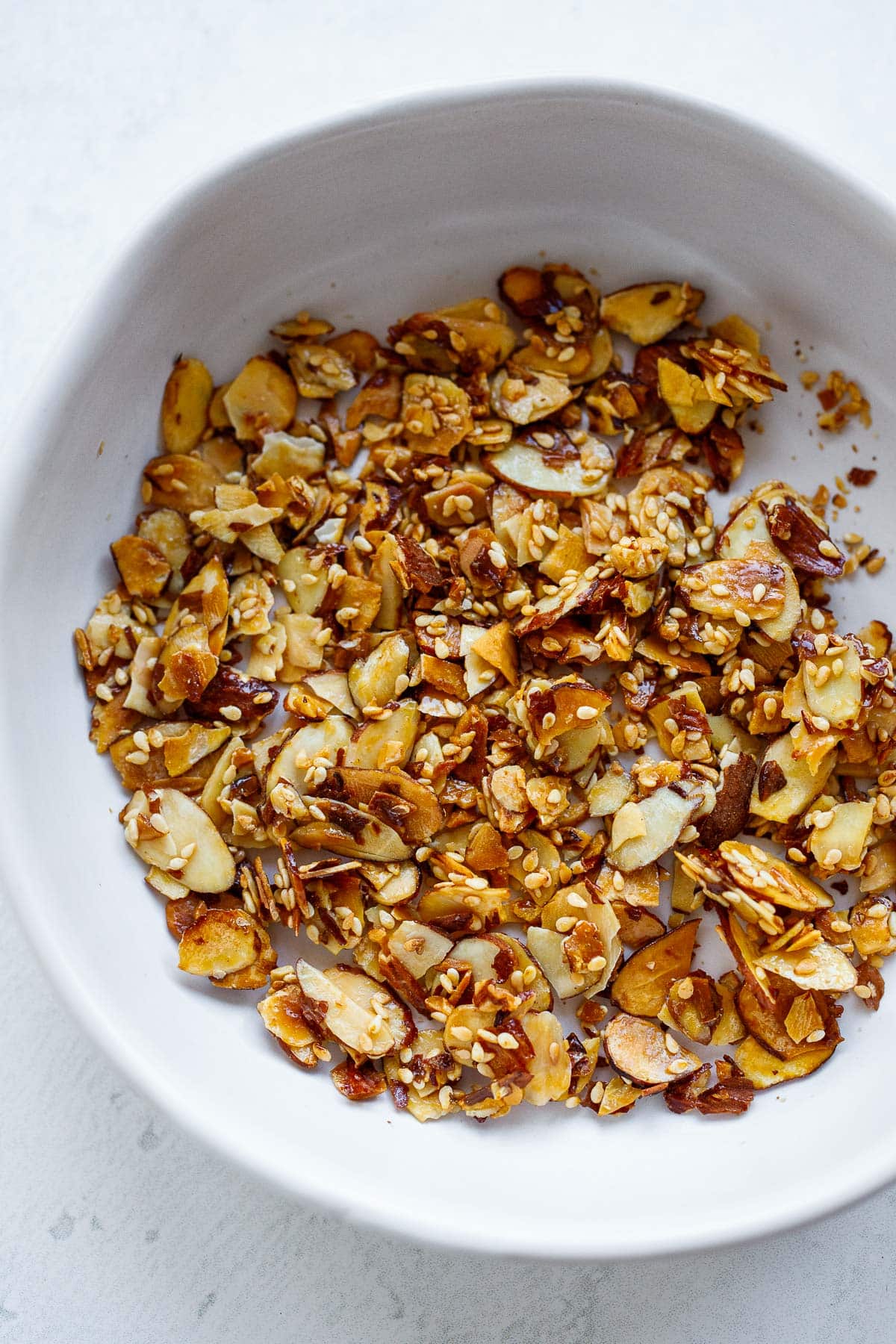 small bowl of sesame almond brittle.