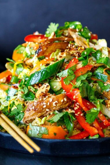The best Chinese Chicken salad recipe on a serving plate with chopsticks.