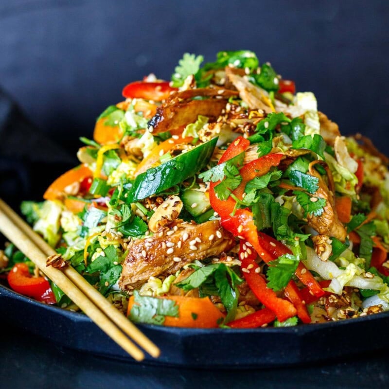 The best Chinese Chicken salad recipe on a serving plate with chopsticks.