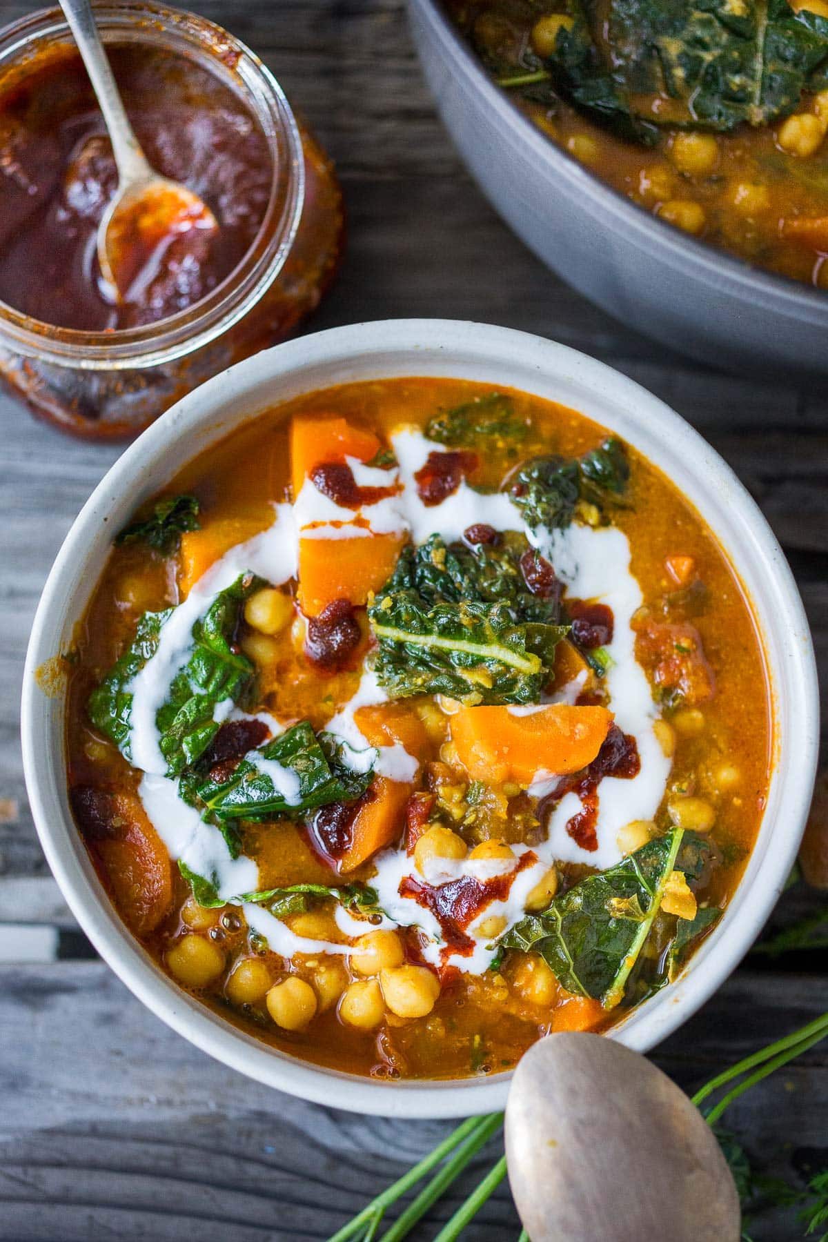 A simple, healthy Tunisian Chickpea Stew with carrots and their tops, kale and a "quick harissa" sauce- hearty and delicious, perfect for cozy nights. Gluten-free and vegan-adaptable. Video!