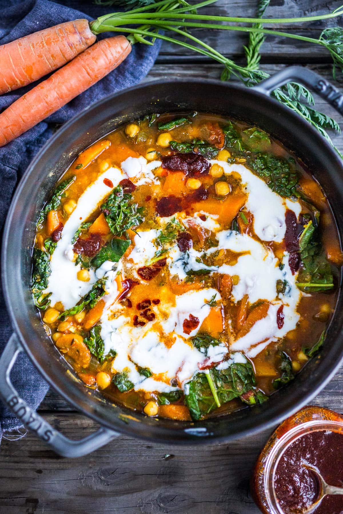 A simple, healthy Tunisian Chickpea Stew with carrots and their tops, kale and a "quick harissa" sauce- hearty and delicious, perfect for cozy nights. Gluten-free and vegan-adaptable. Video!