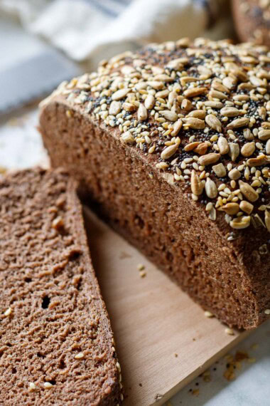 This gluten-free bread recipe is easy to make and tastes like rye bread! Made with teff flour, it's egg-free, dairy-free, nut-free, and made without rice, starches, or gums. Vegan.