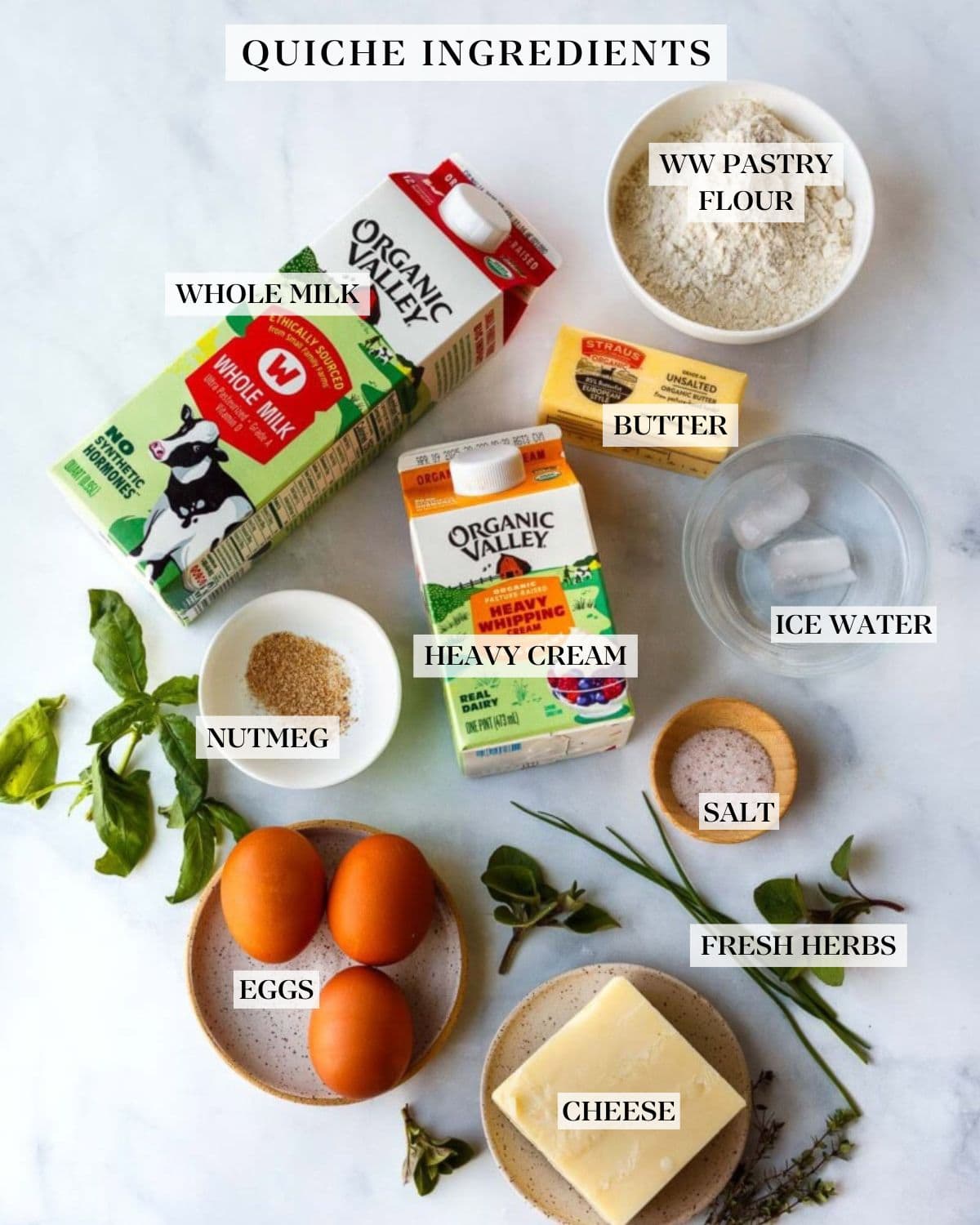 Quiche ingredients on a white counter.