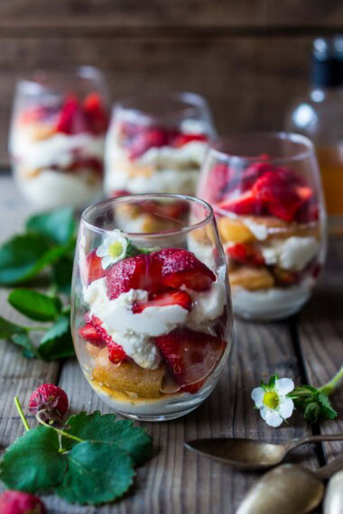 This strawberry tiramisu recipe is the perfect spring dessert. Fresh strawberries are layered with lady fingers soaked in orange juice and St. Germaine (elderflower liqueur) with a whipped mascarpone-yogurt cream. Light and refreshing, this one is a crowd pleaser.