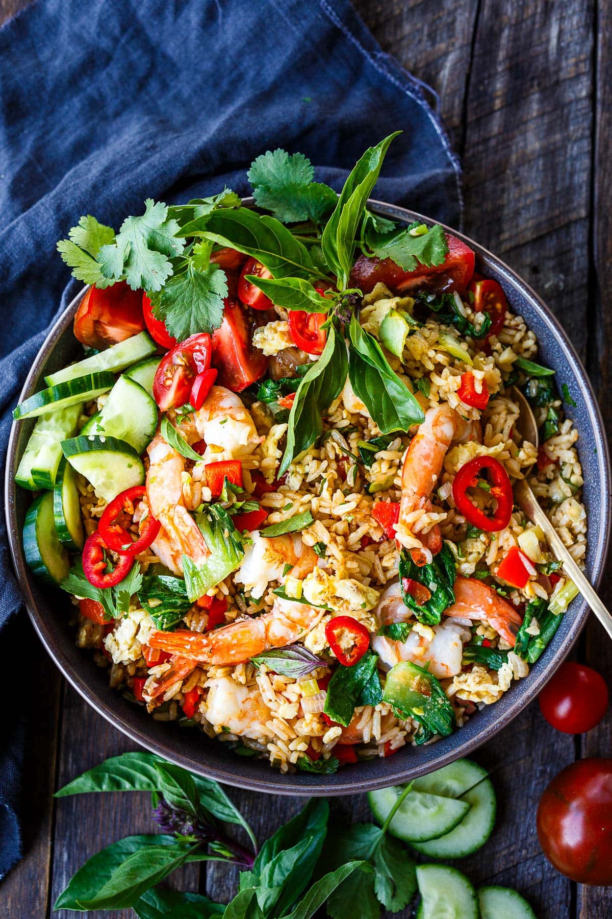 Thai Fried Rice, also known as "Khao Pad," is a flavorful and aromatic dish made with jasmine rice, tender shrimp, veggies, and a savory stir-fry sauce.
