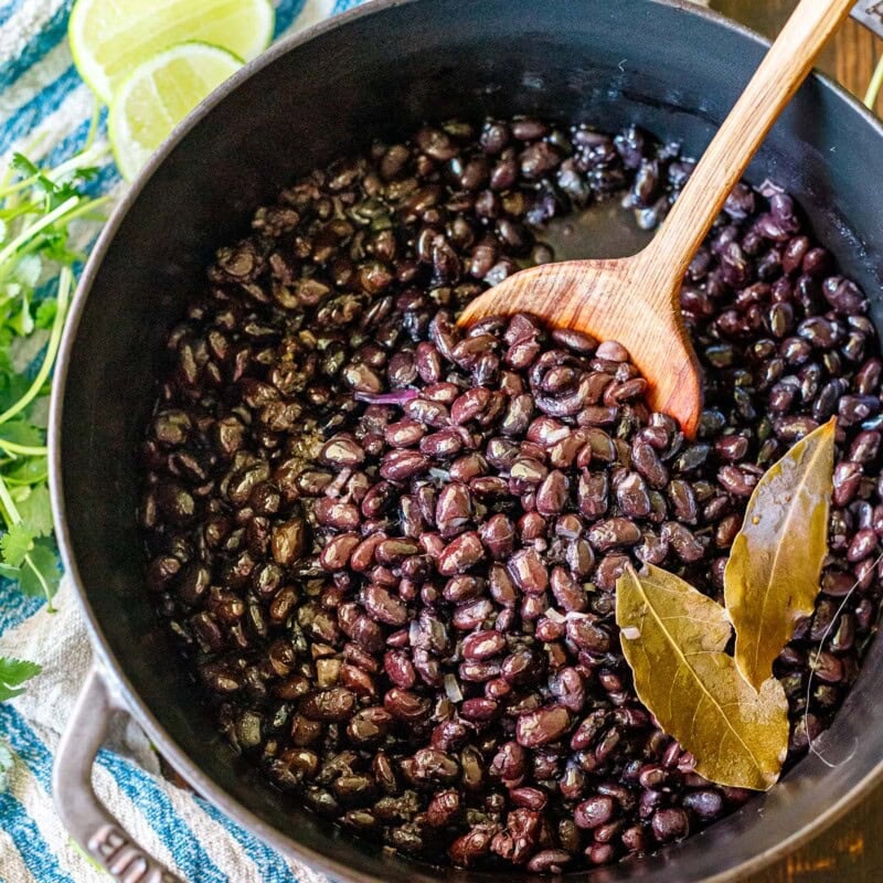 Learn how to cook dry black beans from scratch. This black beans recipe is easy to make and full of flavor, resulting in a creamy interior while holding its structure and shape. A healthy side dish or perfect to use in salads, Buddha bowls, enchiladas, tacos, soups, and more!