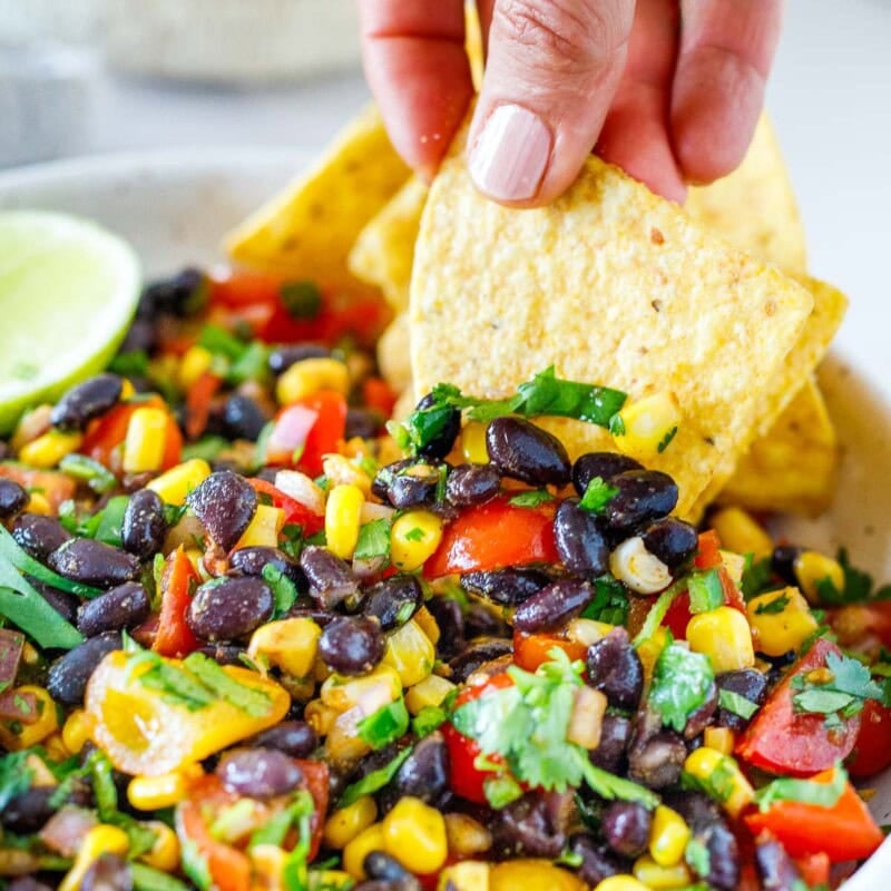 Here is my favorite black bean salsa recipe! The flavors are simple, yet punchy, and it's easy to make in under 15 minutes. Vegan and gluten-free.