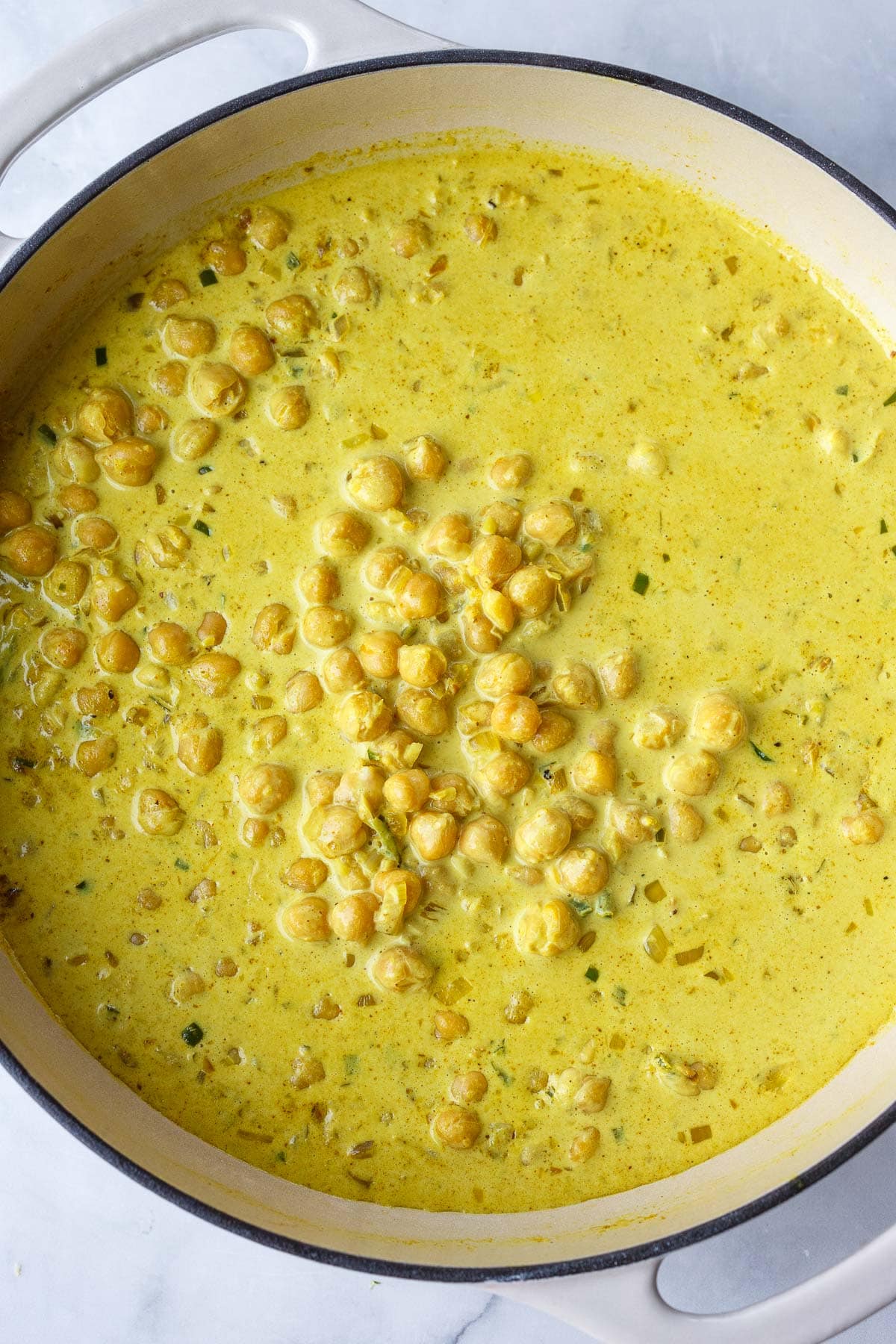 large pan of golden chickpea curry.
