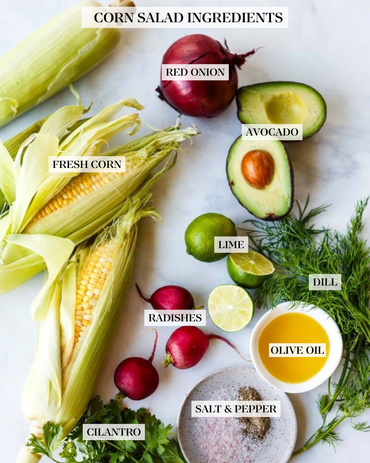 grilled corn salad ingredients on counter, labeled, red onion, avocado, lime, dill, olive oil, radishes, fresh corn, salt and pepper, cilantro.