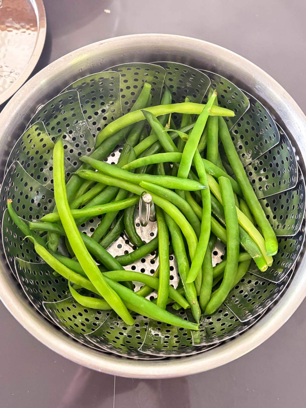 green beans in steamer basket.