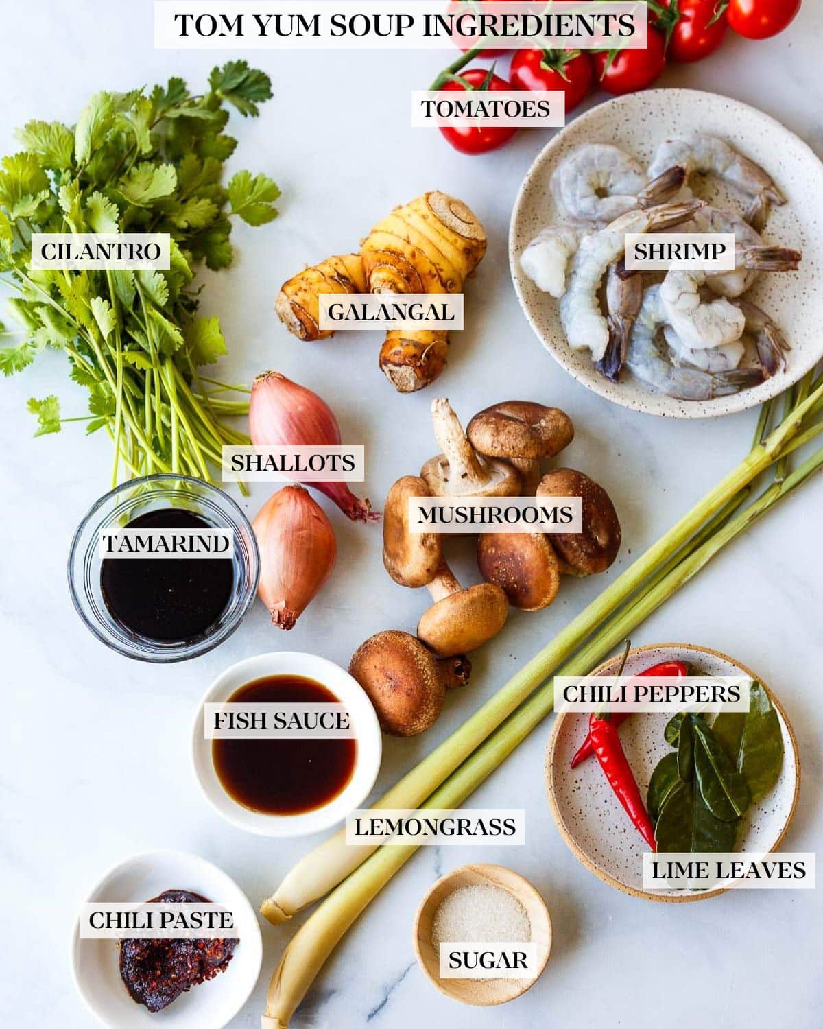 Tom Yum Soup ingredients placed on a white counter.