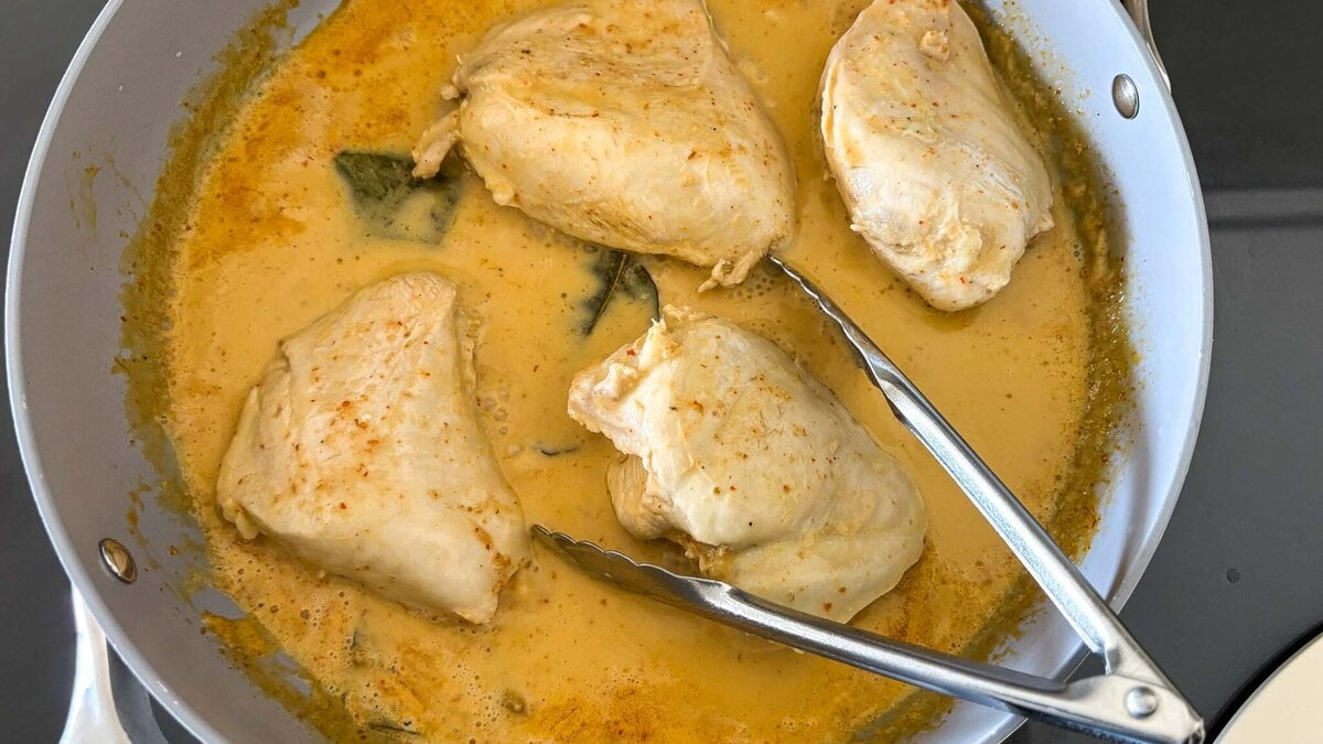 poaching the chicken in the coconut milk. 