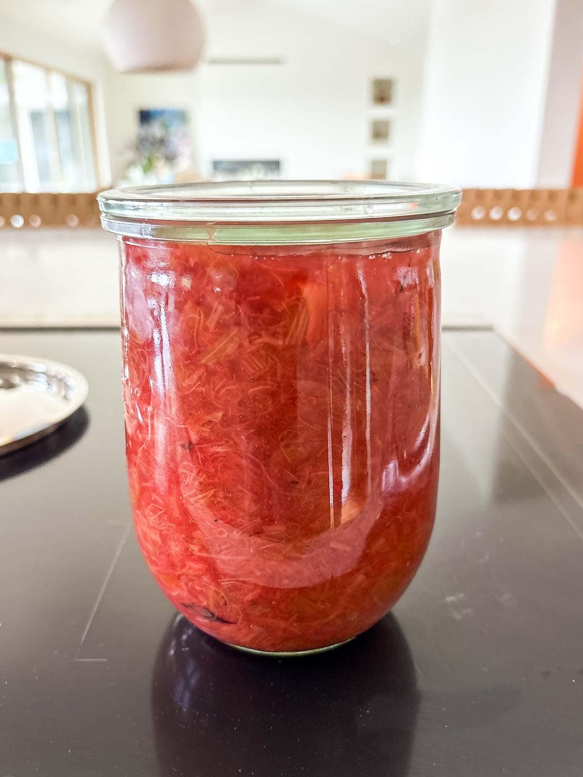 glass jar of freshly made rhubarb compote.