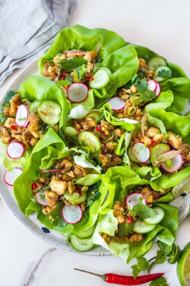 This easy vegan tofu larb salad is fresh, tangy, and bursting with authentic Thai flavors! Serve in crisp lettuce cups for a light summer meal or a flavorful appetizer.
