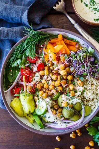 These Mediterranean Chickpea Bowls are loaded with crispy chickpeas, quinoa, fresh veggies, and a creamy tahini sauce. A vibrant, high-protein vegan meal that’s perfect for lunch, dinner, or meal prep.