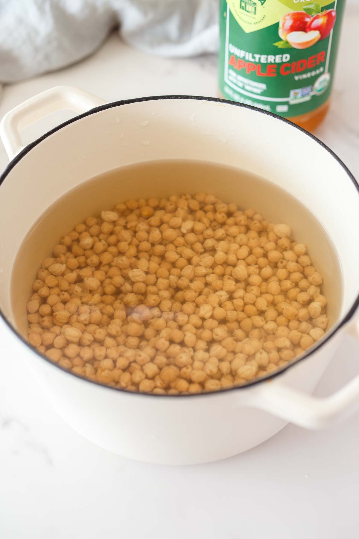dutch oven with dried chickpeas soaking in water.