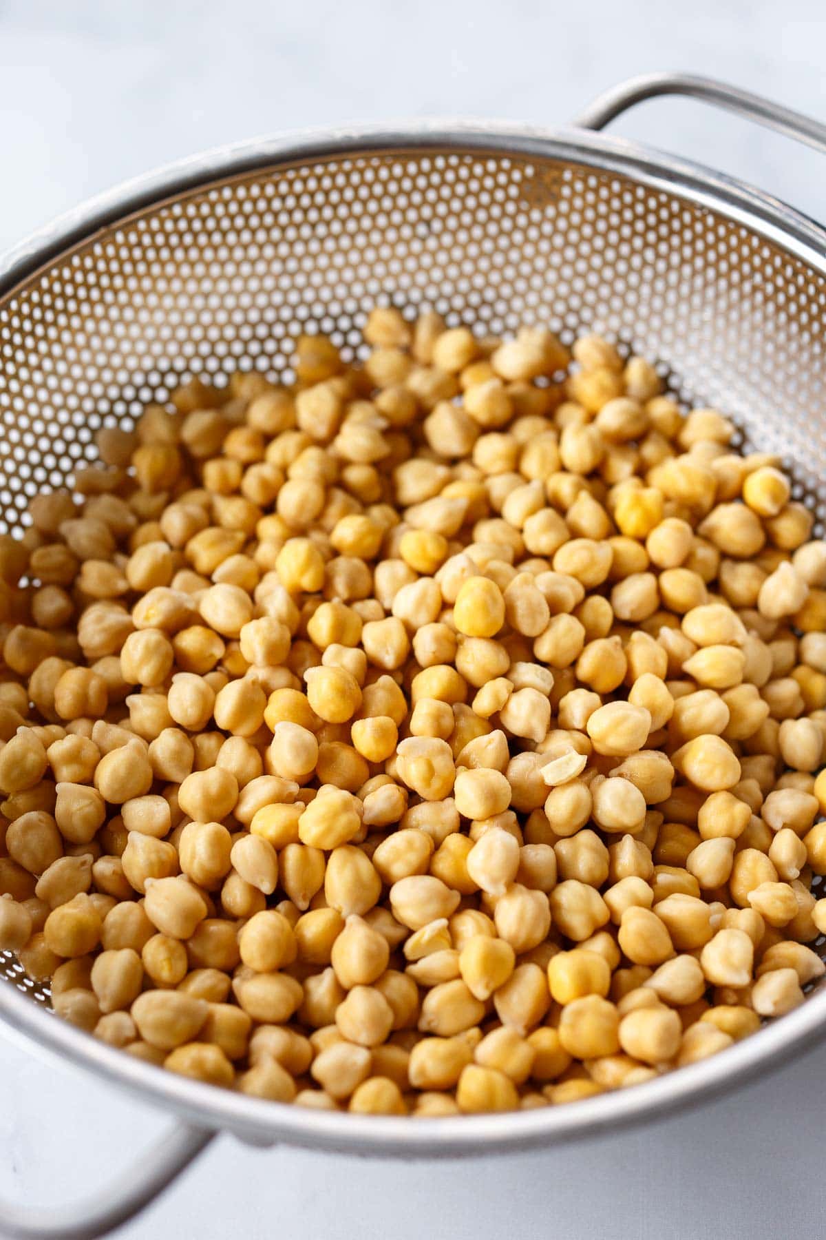 soaked chickpeas drained in colander.