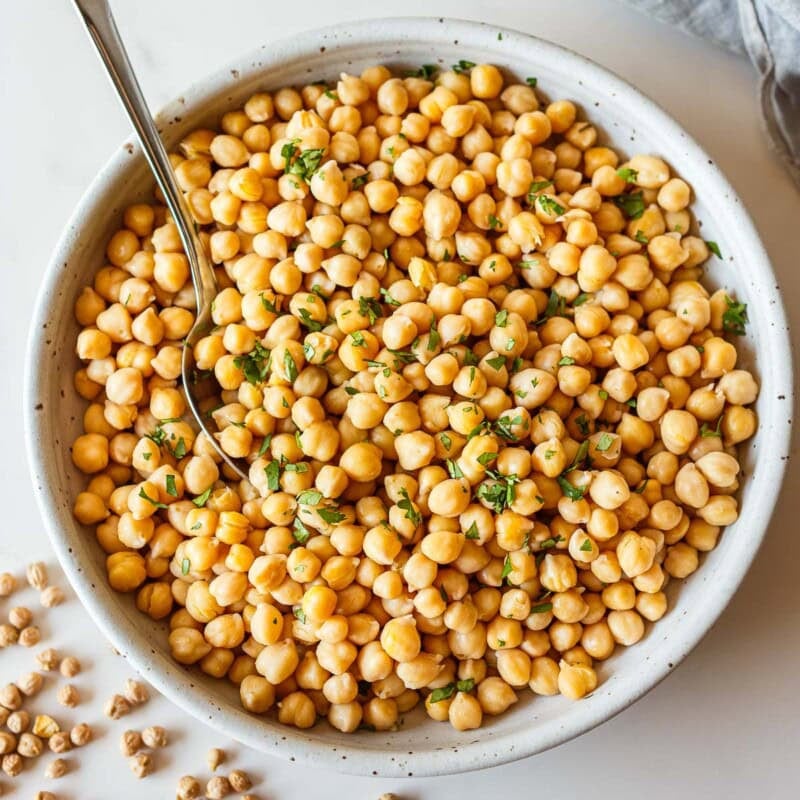 Learn how to cook dried chickpeas from scratch! We'll show you how to soak them and cook them 3 ways: on the stovetop, in the Instant Pot (our favorite), or in a slow cooker. Batch-cook them ahead, for delicious, nutritious meals.