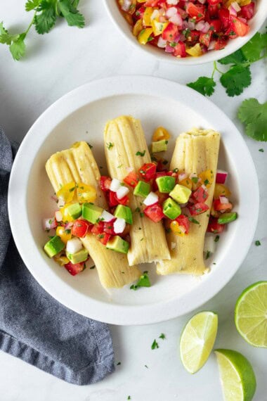 Learn my easy method for making tamales! Includes step-by-step instructions for making delicious tamales filled with green chili and cheese (or shredded chicken) cooked on the stovetop or in an Instant Pot.