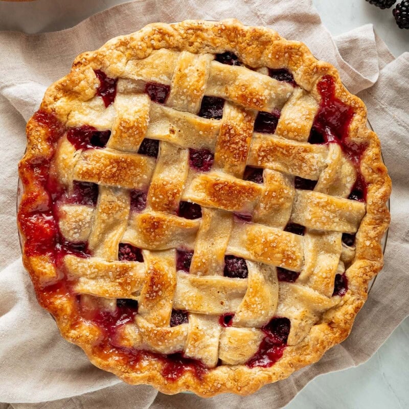 This homemade blackberry pie is bursting with juicy, sweet-tart blackberries and baked in a flaky, golden pie crust. Serve with vanilla ice cream for the ultimate summer dessert.