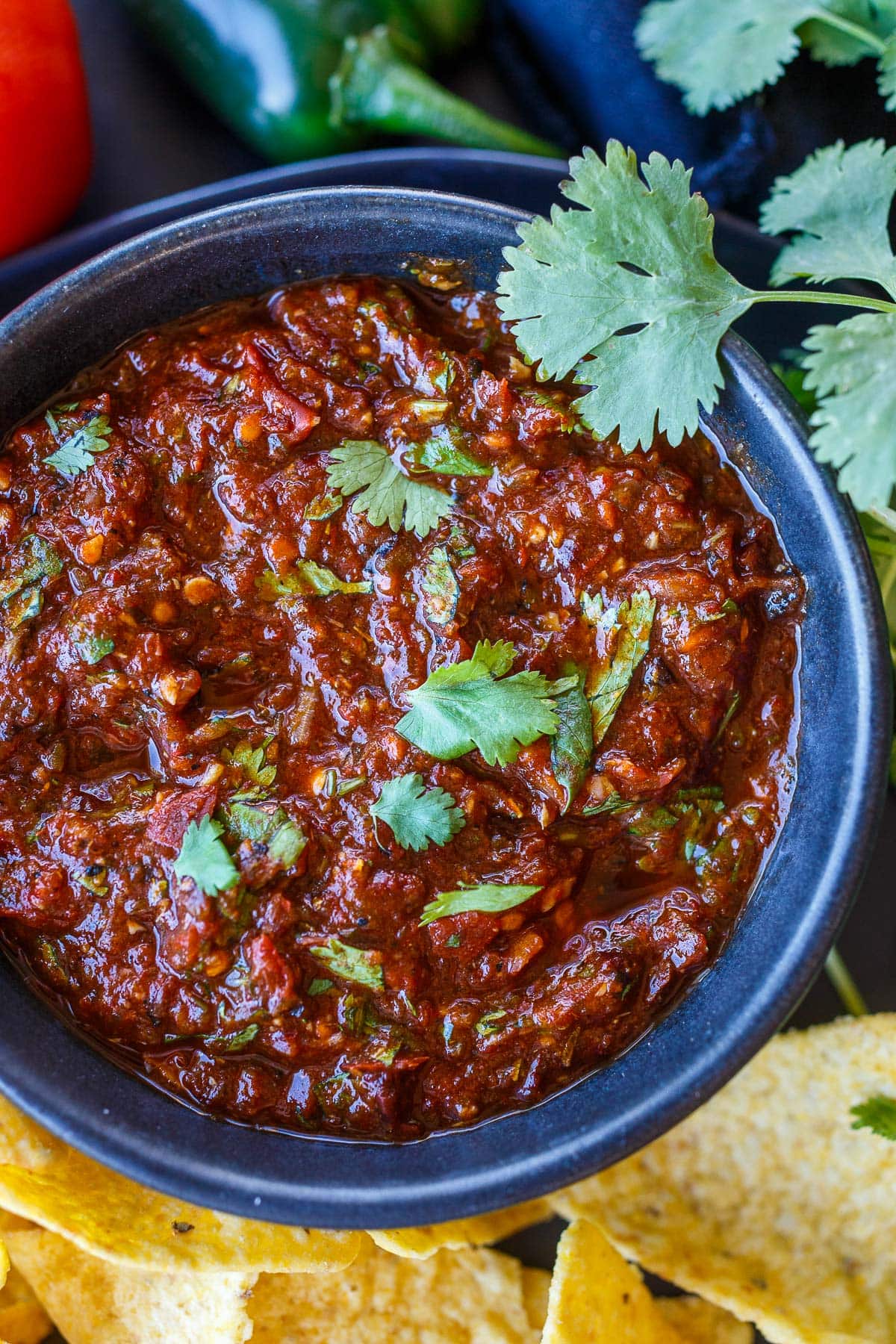 bowl of salsa roja garnished with cilantro.