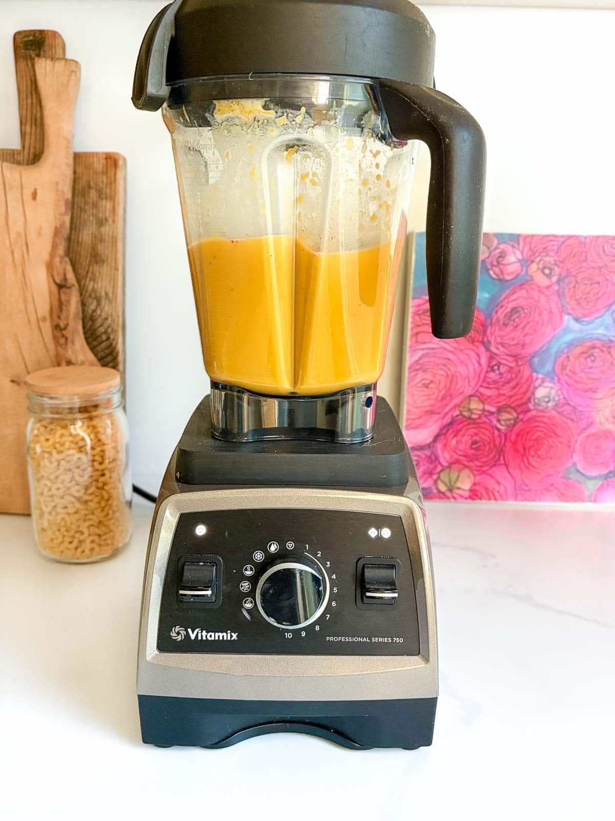 Vitamix with creamy blended butternut squash pasta sauce.