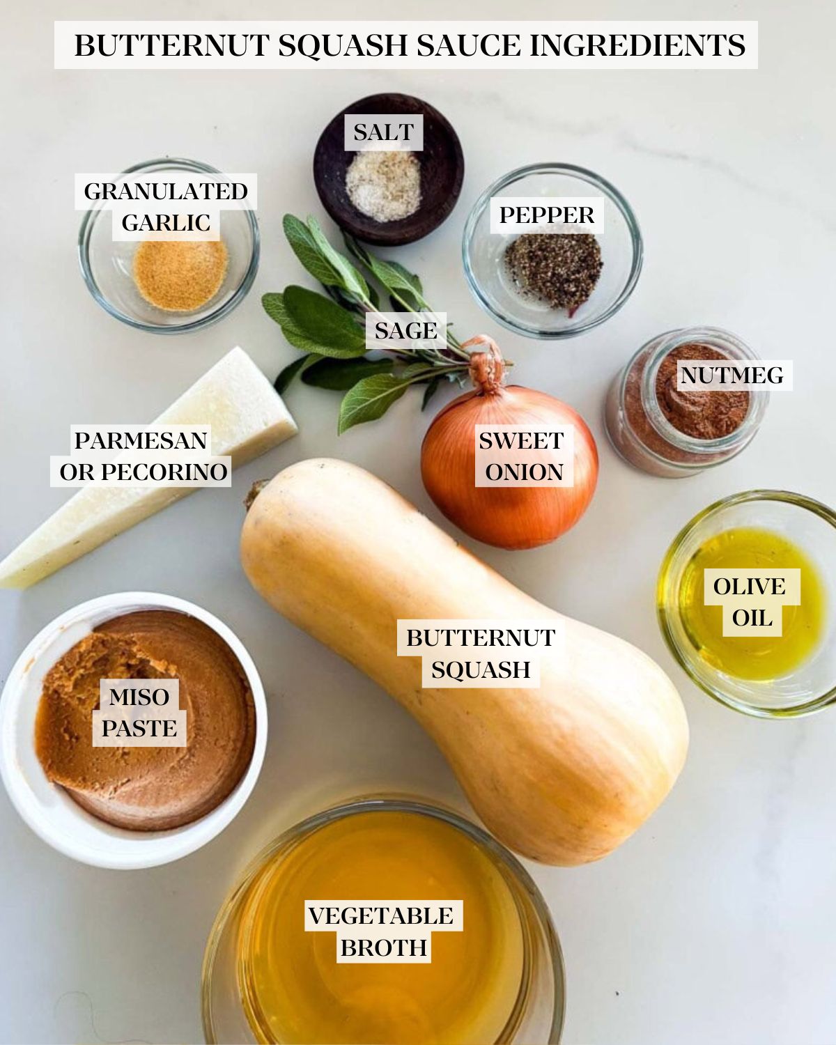 ingredients neatly arranged for butternut squash pasta sauce - granulated garlic, salt, pepper, nutmeg, olive oil, sage, onion, pecorino, butternut squash, miso paste, and broth.