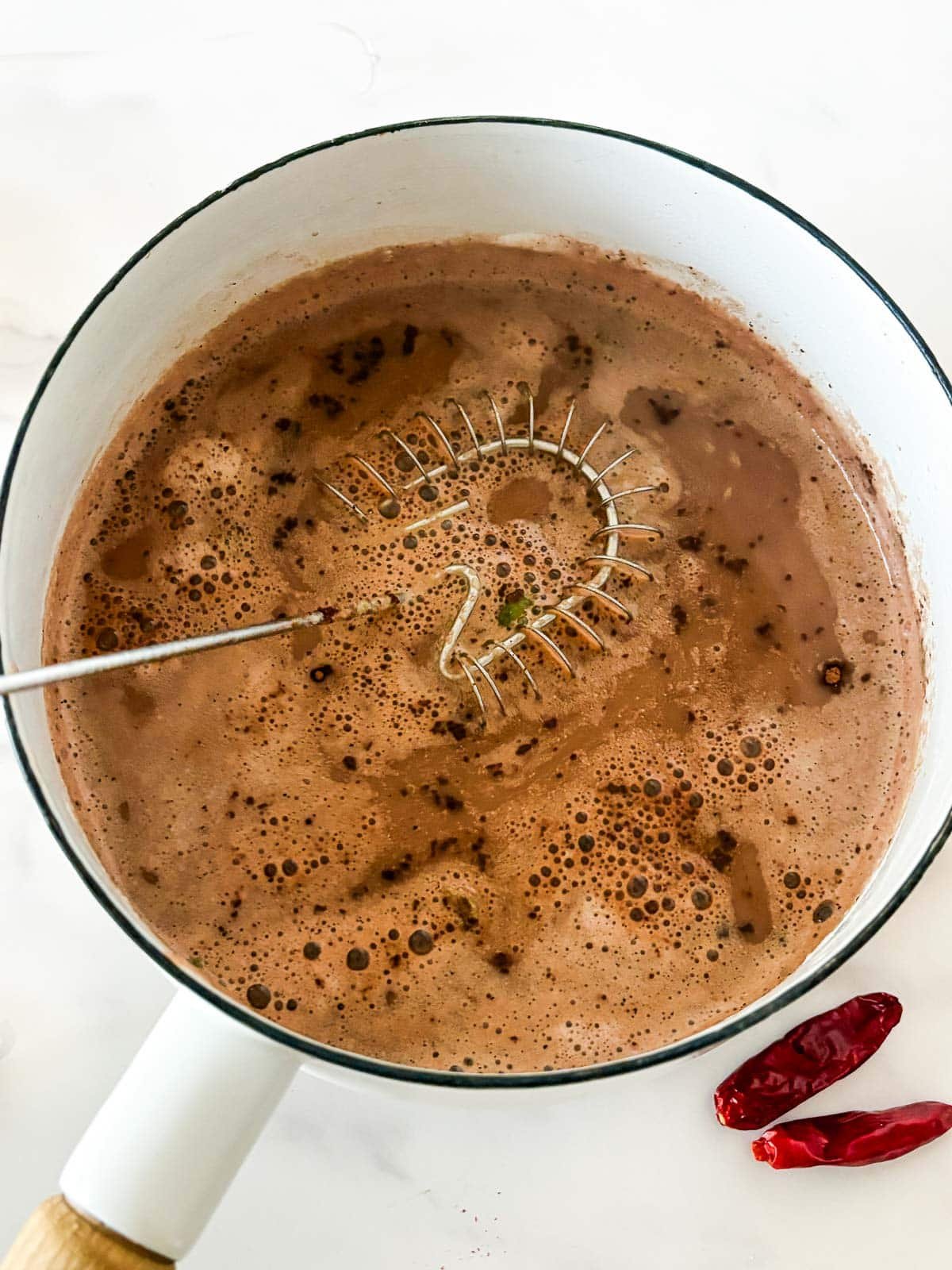 whisk in a pot of Mexican hot chocolate.