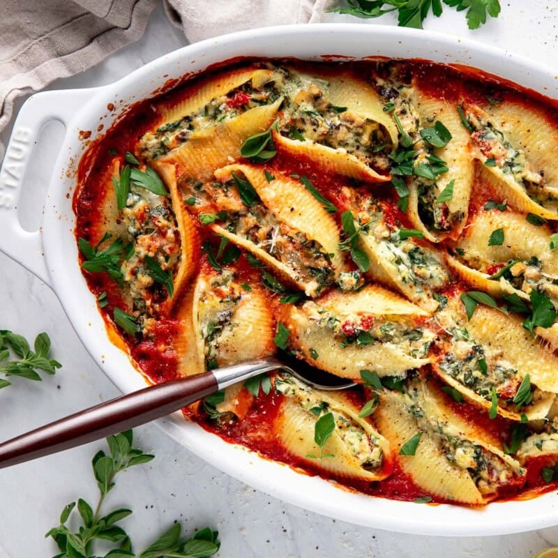 Cozy, satisfying, and bursting with Mediterranean flavor, these Stuffed Shells are filled with ricotta, mushrooms, spinach, and fresh herbs, baked in a rich marinara sauce until bubbly and golden.