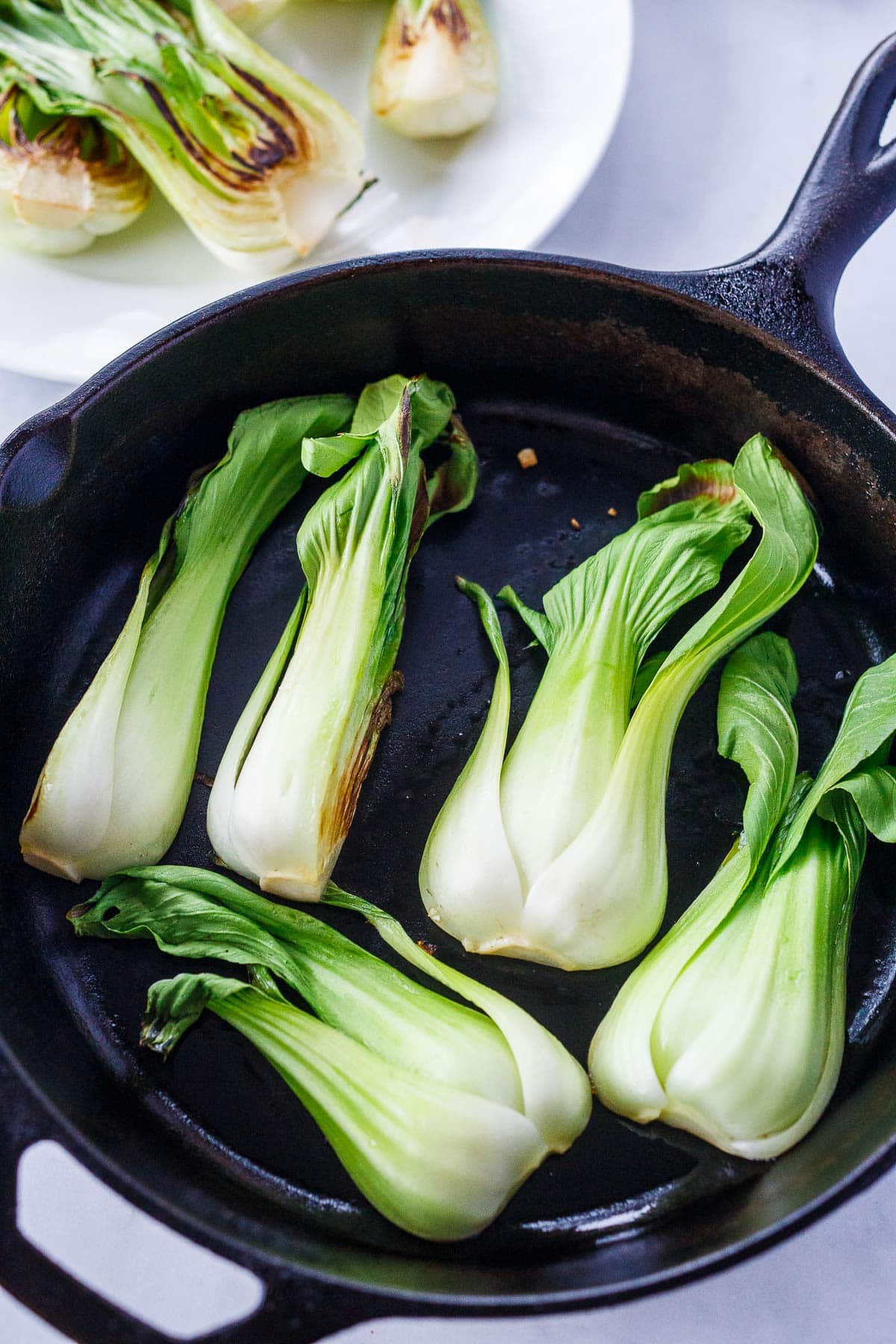 Searing the baby bok choy.