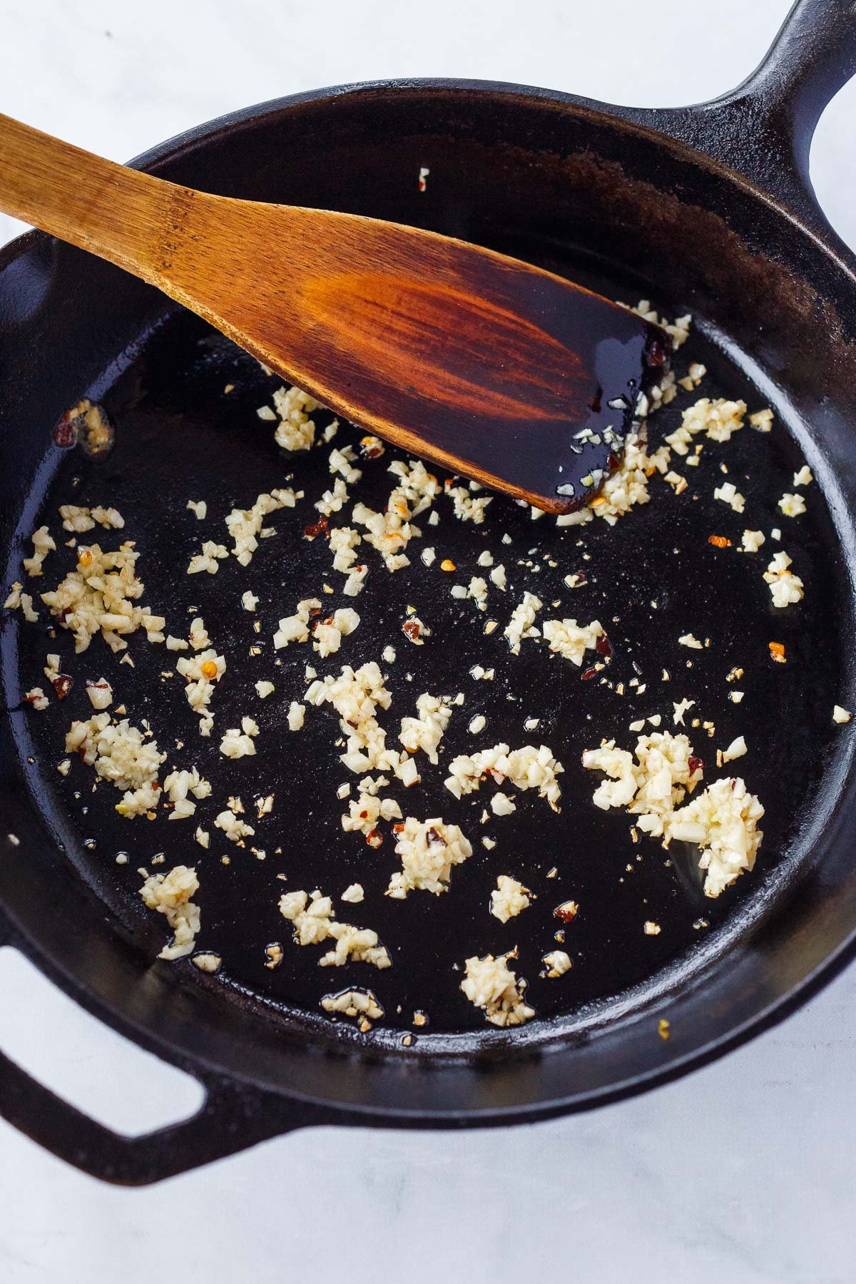 frying the garlic and chili flakes.