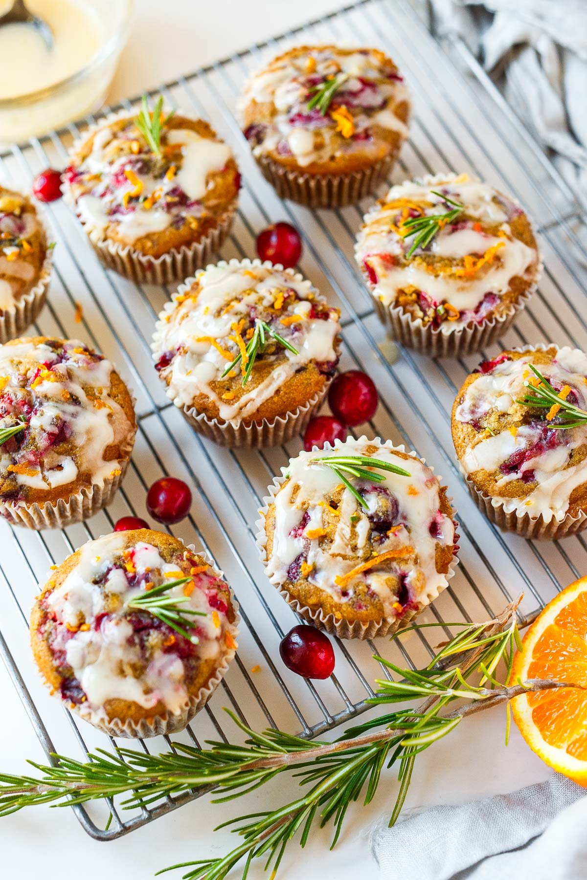 cranberry orange muffins on a wire rack. 