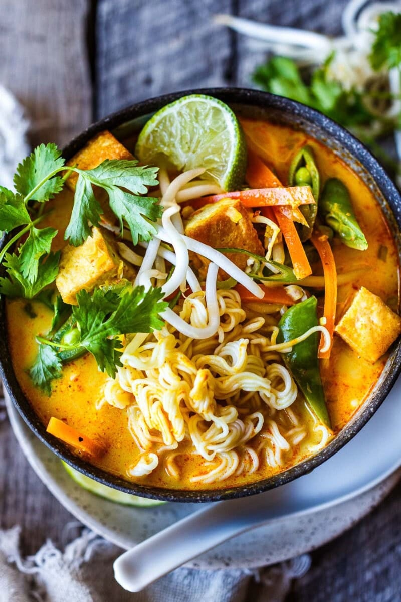 This Curry Ramen recipe features a creamy coconut broth with a kick of warm curry spice, complementing crunchy veggies, tender tofu, and succulent ramen noodles. Vegan.